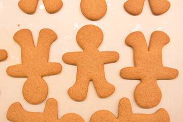 Gingerbread man cookies right out of the oven, freshly made at home, without decoration. Great for cooking with the kids as a family near the Christmas and winter holidays.