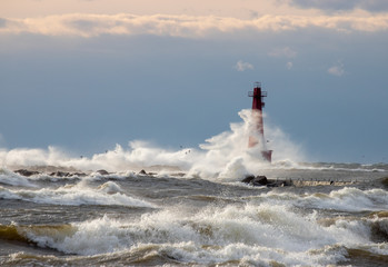 Waves crashing over lighthouse