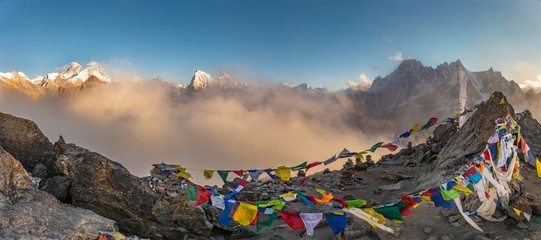 Panoramic shot of colorful Tibetan prayer flags on a mountain