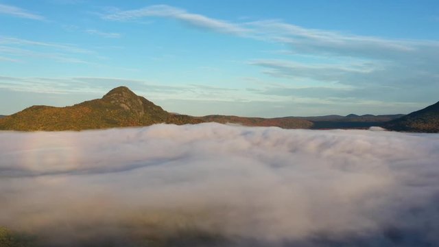 Spectacular Aerial hyper-lapse boiling cloud cover at dawn 4K 