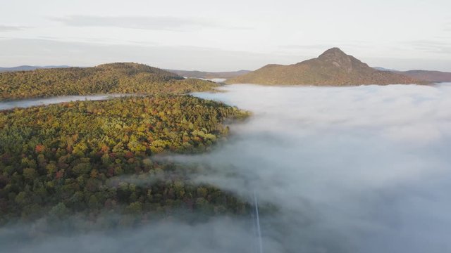 Rotating aerial landscape Fall forestry morning cloud cover 