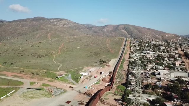 Drone shot above barrier dividing Tijuana and San Diego border