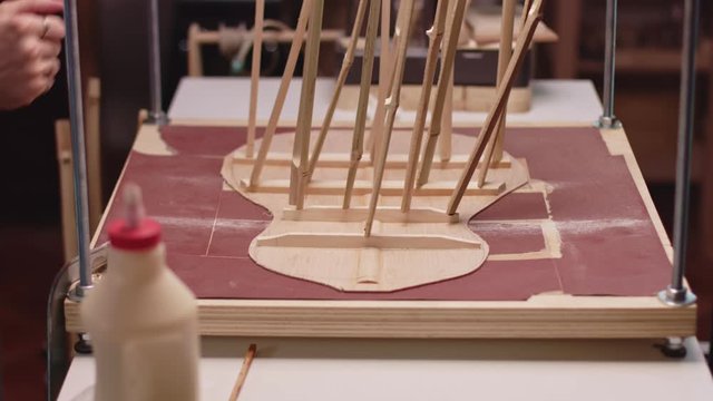 Guitar maker making a guitar
