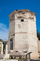 Fototapeta na wymiar Tower of the Winds or the Horologion of Andronikos Kyrrhestes an octagonal Pentelic marble clocktower in the Roman Agora in Athens constructed in the 2nd century BC