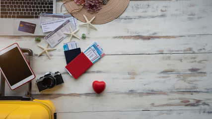 Traveler accessories on wood background, technology internet connect laptop working management business. Top view travels vacation people, Holiday tourism has happiness beautiful, Summer background.