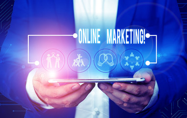 Text sign showing Online Marketing. Business photo text leveraging web based channels spread about companys brand Male human wear formal work suit presenting presentation using smart device