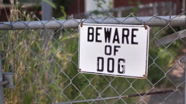 Beware Of Dog Sign On Chainlink Fence