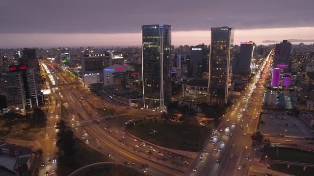 Left travelling Aerial night view of San Isidro district