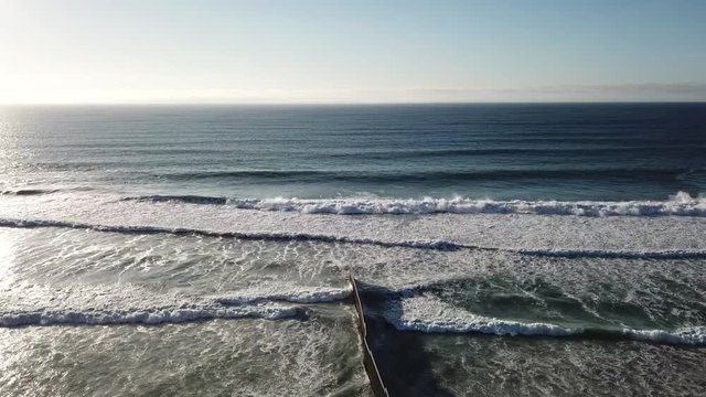 drone fly over the border barrier between mexico and united states