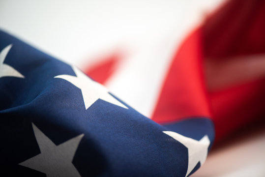 Closeup of American flag on plain background