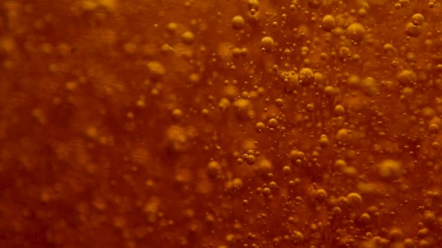 Light moves from left to right through the orange bubbles