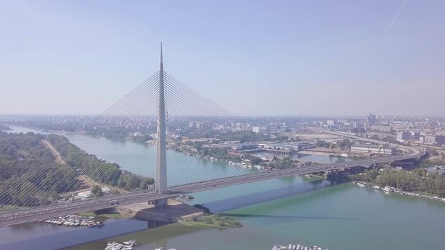 Slow beautiful panorama shot of Ada bridge in Belgrade and New Belgrade on Sava river