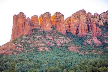 Sedona iconic Coffee Pot Rock red sandstone formation glowing pink at sunset