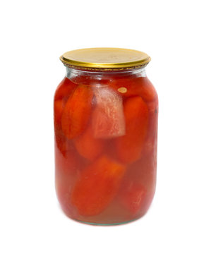 Glass jar with tomatoes closed on a white background.
