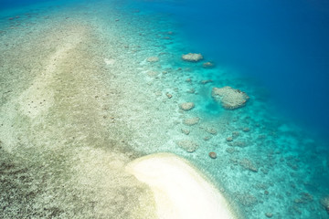 Aerial of sandbank and coral reef on small island in Fiji