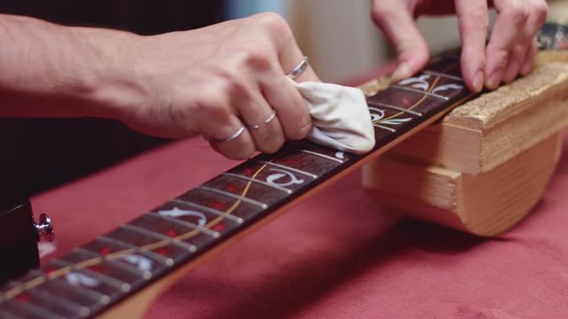 Professional guitar maker polish guitar neck