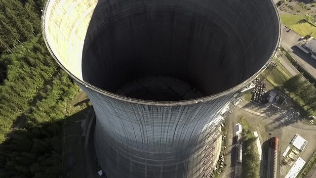 A top down rotation shot of around the abandoned nuclear power plant stack opening at Satsop, Wa.