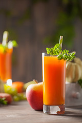 Pumpkin, carrot and apple juice in glass