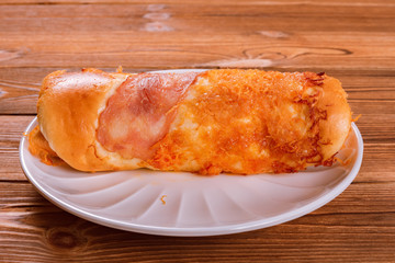side view bread with bacon and shredded pork