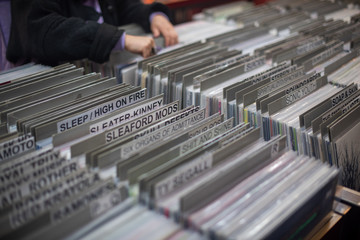 Woman searching through vinyl records