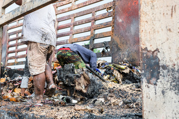 Poor people digging, searching and collecting rubbish for sale in Thailand.