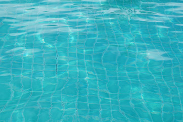 Background of rippled pattern of clean water in swimming pool 