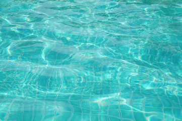 Background of rippled pattern of clean water in swimming pool 