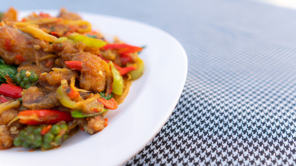 Stir-Fried Spicy Fish  on white dish,select focus.