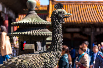 Bronze statue of phoenix in front of Yukun Palace, one of the Six Western Palaces, in the Forbidden City.the main buildings of the former royal palace in Beijing China.