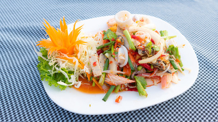 Spicy Mixed Salad on white dish, select focus.