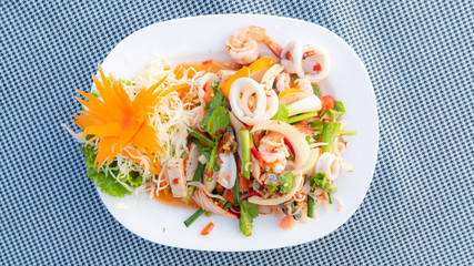 Spicy Mixed Salad on white dish, select focus.