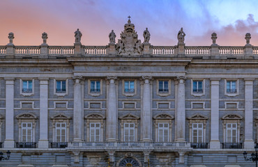 Fototapeta na wymiar Sunset view of the ornate baroque architecture of the Royal Palace viewed from Plaza de Oriente in Madrid, Spain