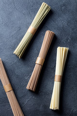 Noodles soba on slate background. Traditional Japanese food. Top view.