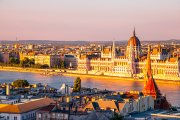 Fototapeta premium Hungarian Parliament Building with Danube river at sunset in Budapest, Hungary