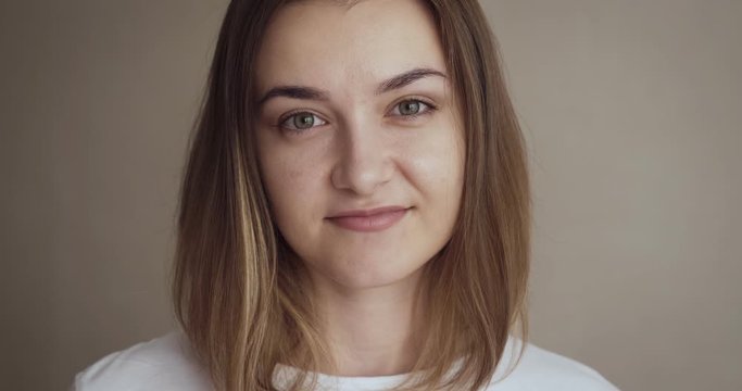Portrait of young woman smirk on camera.