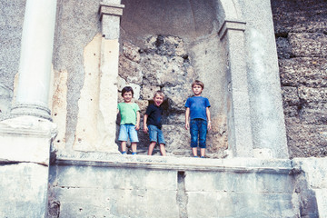 Fototapeta na wymiar little boy exploring ancient architecture, lifestyle people on summer vacation close up