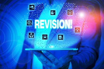 Text sign showing Revision. Business photo text action of revising over someone like auditing or accounting Male human wear formal work suit presenting presentation using smart device