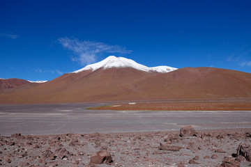 Laguna Colorada. Landscape of Siloli Desert. Snow-capped volcanoes and desert landscapes in the highlands of Bolivia. Andean landscapes of the Bolivia Plateau