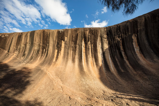 Wave Rock, a 15 metre high natural rock formation that is shaped like a tall breaking ocean wave and is located at Hyden in Western Australia