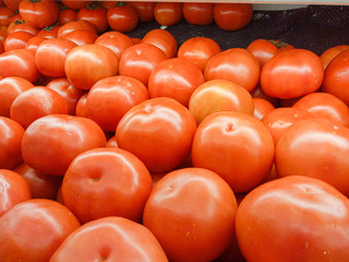 bunch of Delicious red tomatoes. market agriculture farm full of organic vegetables It can be used as background