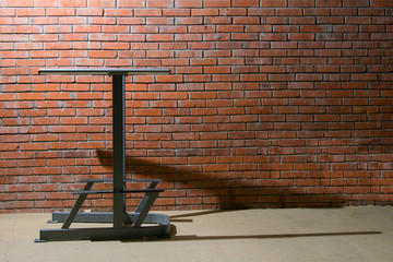 against a background of orange brick, a sports simulator for athletics, with a place for inscription