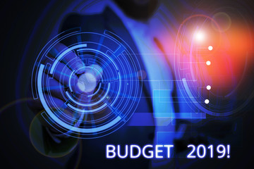 Writing note showing Budget 2019. Business concept for estimate of income and expenditure for current year Male wear formal suit presenting presentation smart device
