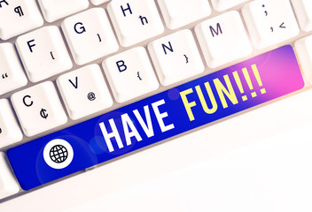 Writing note showing Have Fun. Business concept for wish somebody good and enjoyable time when they do something White pc keyboard with note paper above the white background
