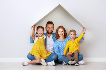 concept housing a young family. mother father and children in  new home.