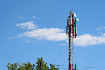 Cellular antenna against blue sky with copy space. Concept of modern business communication.