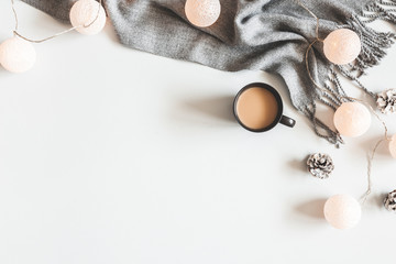 Christmas composition. Cup of coffee, scarf on gray background. Christmas, winter concept. Flat lay, top view, copy space