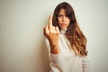 Young beautiful woman wearing winter sweater standing over white isolated background Showing middle...