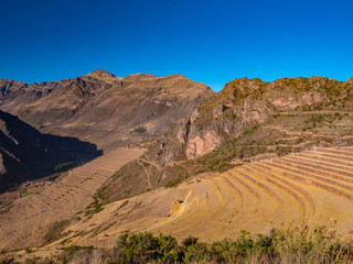 Panoramic view of the ancient Inca ruins of Pisac Archaeological Park. Pisac in the Sacred Valley near Cusco, Peru.