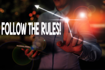 Writing note showing Follow The Rules. Business concept for go with regulations governing conduct...