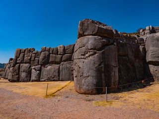 Carved, polished and perfectly rounded stone blocks form the inca walls of Sacsayhuaman, Cusco, Peru